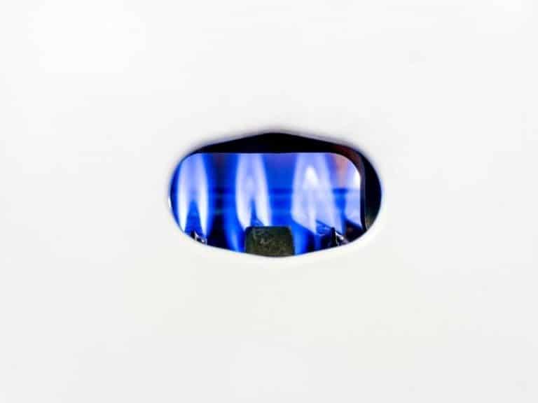 Gas Pilot Light Behind A White Cover