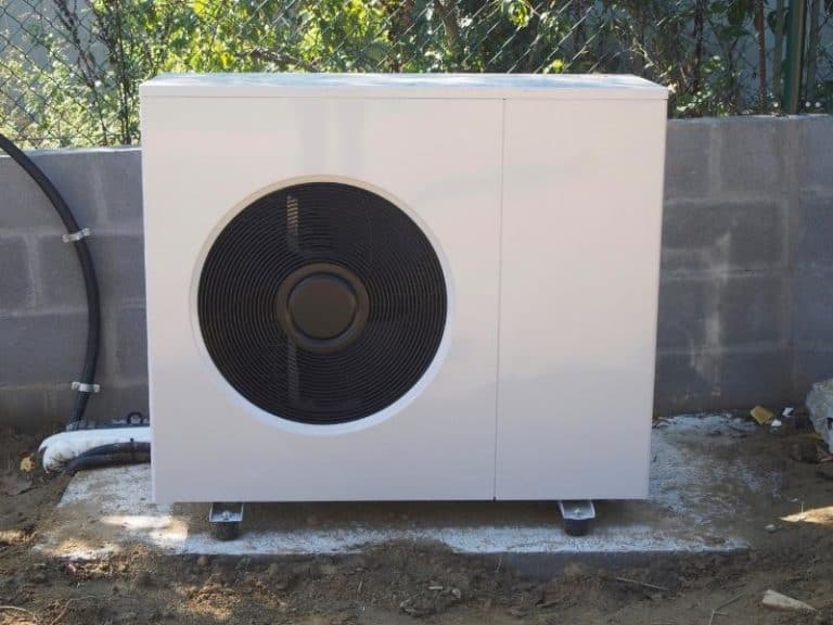 Heat pump positioned away from a house