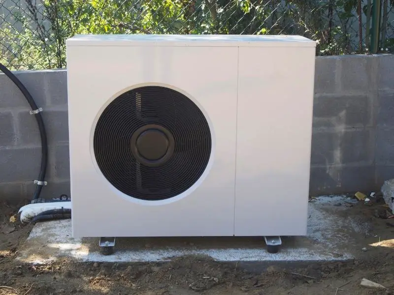 Heat pump positioned away from a house