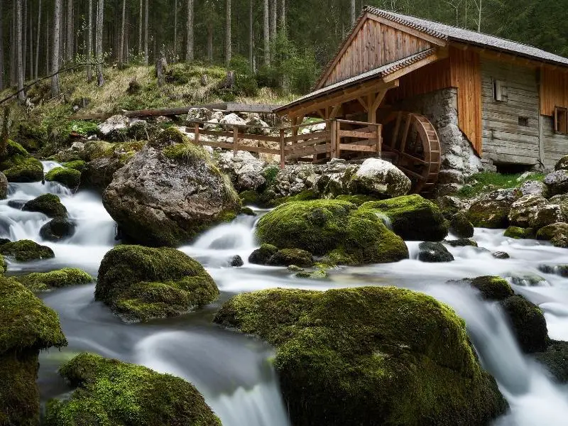 House next to a river with hydropower