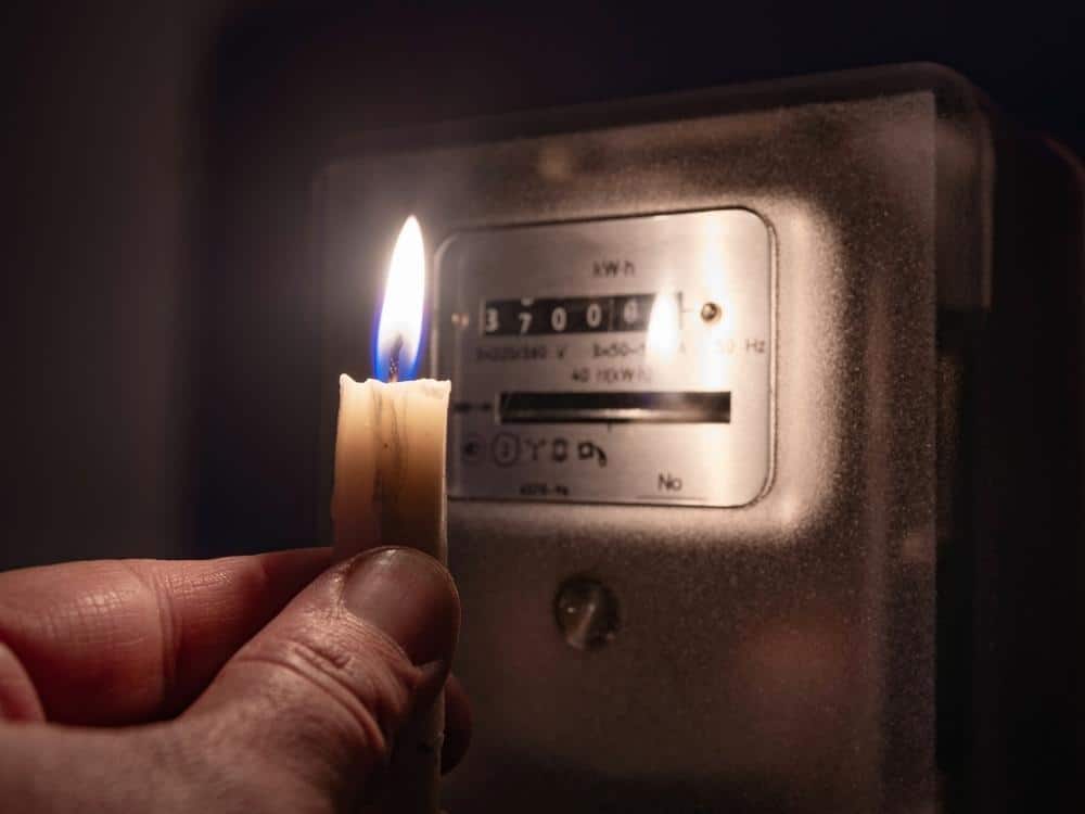 Candle in front of electric meter