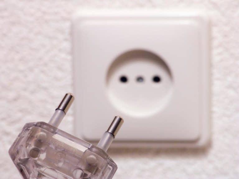 Electric plug with two holes and outlet