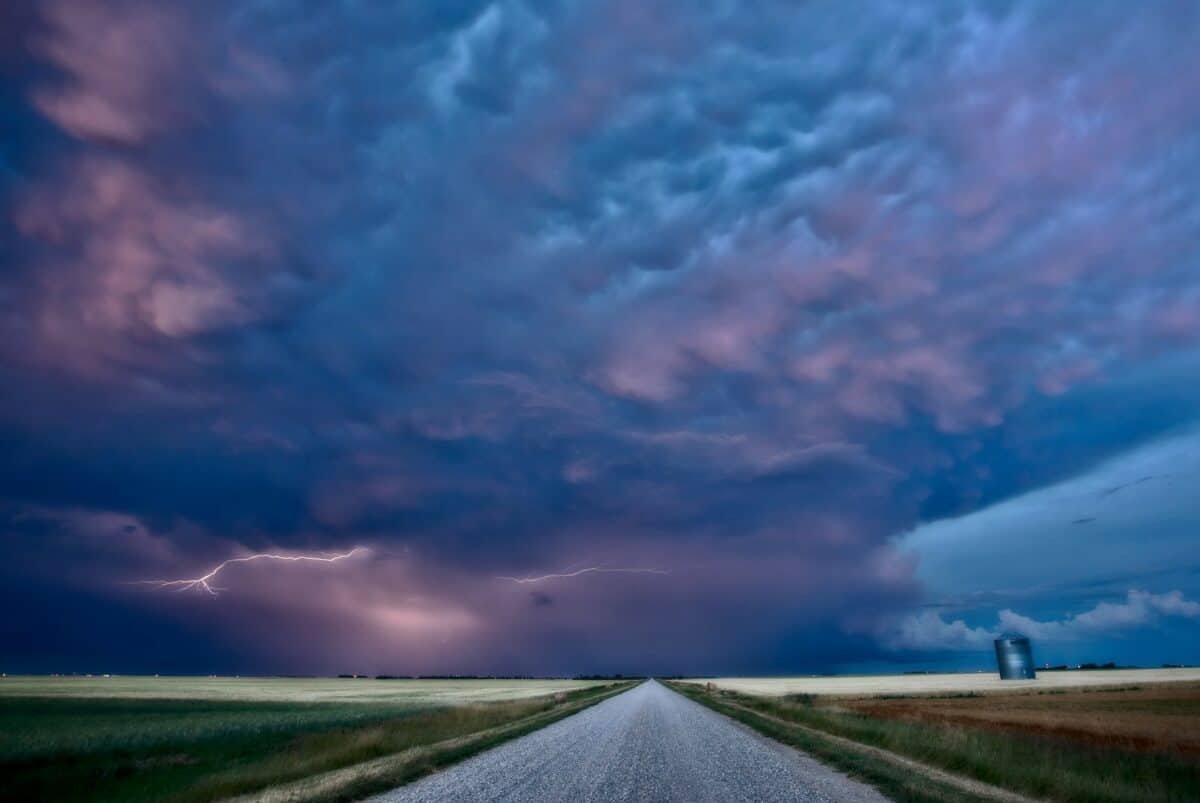 Night Lightning Canada Saskatchewan Prairie storm and road.